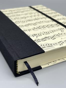 Bindung Lesebändchen Buch Leinenrücken Gummiband handgebunden Notizen schwarz Musik Noten